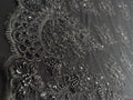 Tissu perlé motif dentelle